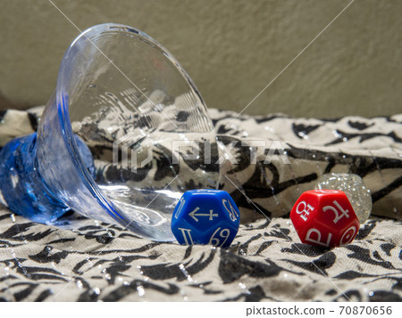 A fallen glass and three rolled dice for fortune-telling A fallen glass and three rolled dice for fortune-telling 70870656