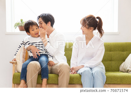 Family relaxing on the sofa Family relaxing on the sofa 70871574