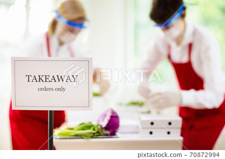 Food takeaway during coronavirus outbreak. 70872994