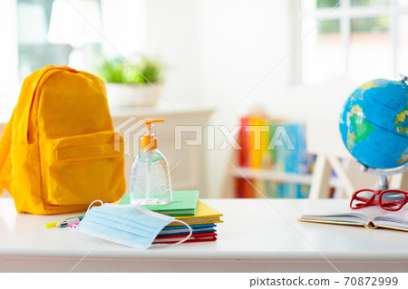 Backpack of school child. Face mask and sanitizer. 70872999