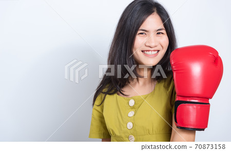 Young woman standing smile in boxing gloves 70873158