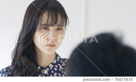A couple staring at each other with a sad face A couple staring at each other with a sad face 70873635