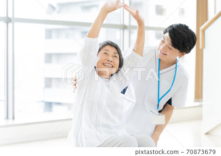 Senior woman rehabilitating and physiotherapist Senior woman rehabilitating and physiotherapist 70873679