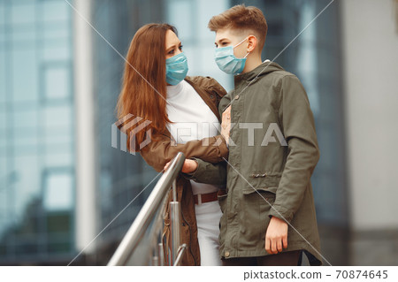 Mother and son are wearing disposable masks Mother and son are wearing disposable masks 70874645
