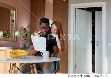 young supportive woman entertains, talk with working man 70875128