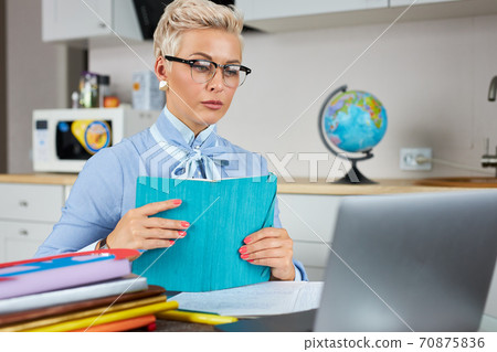 caucasian female young school teacher using webcam at home 70875836