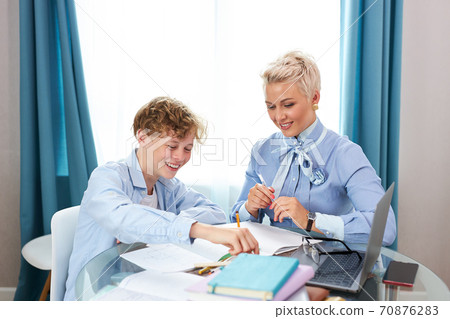 math teacher teach young teen boy at home 70876283