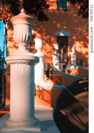 Porch with white stone columns Porch with white stone columns 70876511