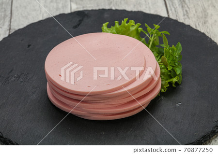 Sliced pork natural sausages over board 70877250