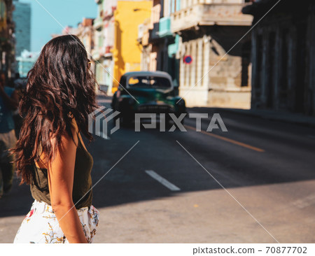 Woman walking at old sreets of Havana in Cuba Woman walking at old sreets of Havana in Cuba 70877702