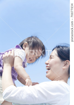 Mother holding a child 70877834