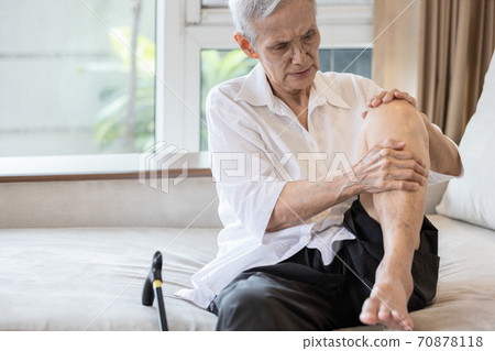 Exhausted asian senior woman hold her knee suffering from pain in knee joint,elderly patient massage her knees with hands,painful facial expression,rheumatic disease,Osteoarthritis in the old people Exhausted asian senior woman hold her knee suffering from pain in knee joint,elderly patient massage her knees with hands,painful facial expression,rheumatic disease,Osteoarthritis in the old people 70878118