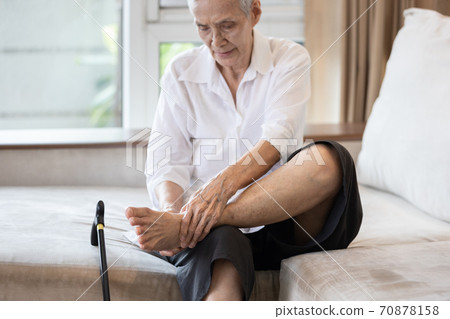 Old elderly with foot injuries,ankle bone diseases,heel pain or soles,asian senior woman suffering from peripheral neuropathy,beriberi,nerve inflammation of the foot, numbness of the feet and toe 70878158