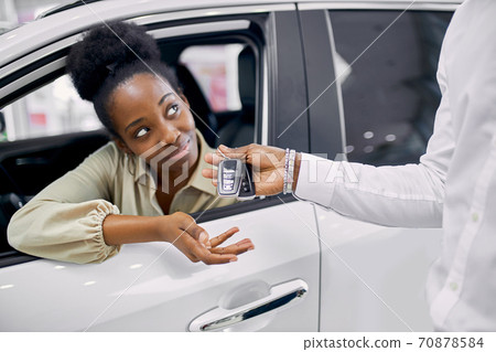 young african woman fulfilled her dream, bought a car young african woman fulfilled her dream, bought a car 70878584