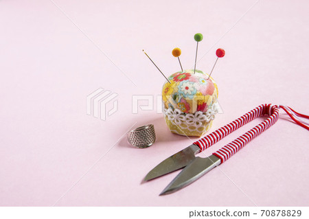 Dressmaking tools: pincushion and thread scissors Dressmaking tools: pincushion and thread scissors 70878829