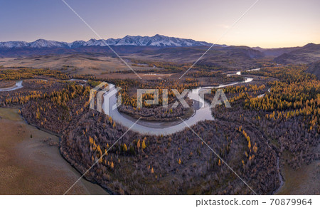 Kurai Steppe, Chuya River, Yellow Larches and Mountains at Sunset in Autumn. Aerial View. Altai Kurai Steppe, Chuya River, Yellow Larches and Mountains at Sunset in Autumn. Aerial View. Altai 70879964