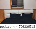 bedroom. Bedroom. White double bed and black quilt 70880512
