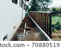 A simple wooden fence that can be rebuilt each time it breaks due to typhoon damage 70880519