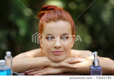 portrait of a woman lying on spa bed. portrait of a woman lying on spa bed. 70881740
