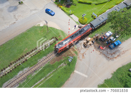 Aerial view of Thai local old classic train on railway on River Kwai Bridge in Kanchanaburi town, Thailand in public transportation concept. Aerial view of Thai local old classic train on railway on River Kwai Bridge in Kanchanaburi town, Thailand in public transportation concept. 70881838