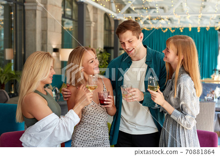 group of best friends having a great time in restaurant, celebrating birthday or corporate group of best friends having a great time in restaurant, celebrating birthday or corporate 70881864