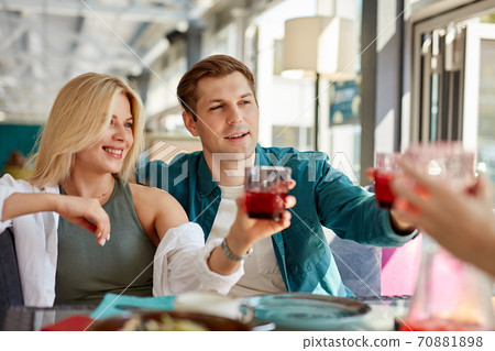 group of happy friends celebrating in cafe group of happy friends celebrating in cafe 70881898