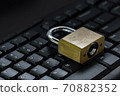 Master key on black keyboard, computer security privacy 70882352