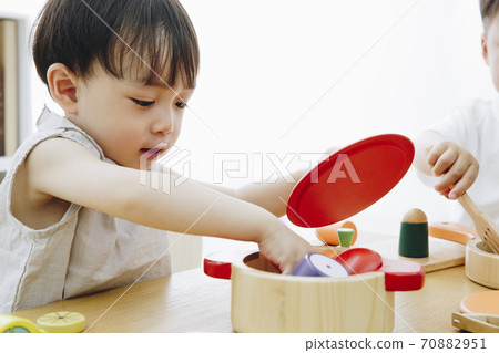 Infants playing with toys Infants playing with toys 70882951