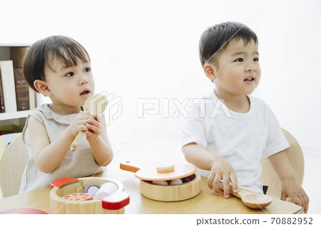 A boy playing with a toy A boy playing with a toy 70882952