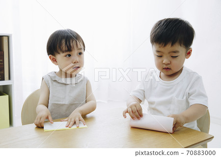 Boy making origami 70883000