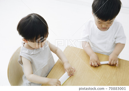 Boy making origami Boy making origami 70883001