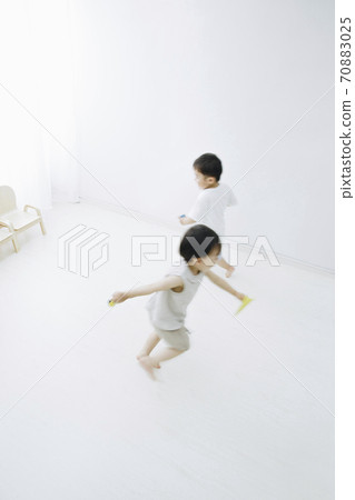 Infants playing indoors Infants playing indoors 70883025
