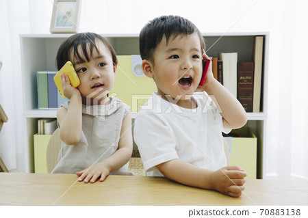 Children playing with a smartphone 70883138
