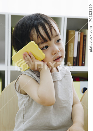 Children playing with a smartphone 70883139