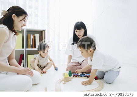 Parent and child playing with toys 70883175