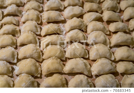 Traditonal Polish food called pierogi in raw form Traditonal Polish food called pierogi in raw form 70883345