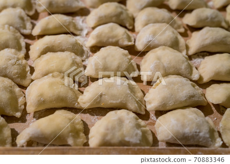 Traditonal Polish food called pierogi in raw form Traditonal Polish food called pierogi in raw form 70883346