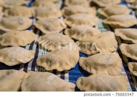 Traditonal Polish food called pierogi in raw form 70883347