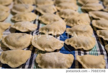 Traditonal Polish food called pierogi in raw form 70883348