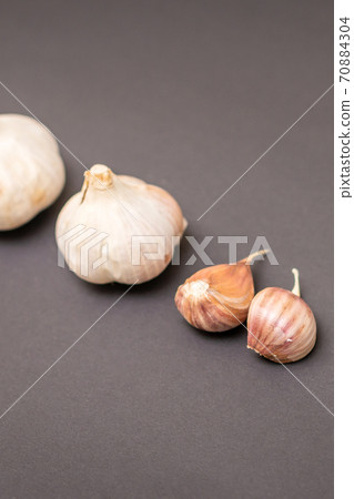 Two garlic heads and garlic cloves 70884304