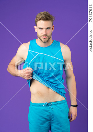 Scars adorn man. Guy handsome unshaven with scar after surgery on abdomen Scars adorn man. Guy handsome unshaven with scar after surgery on abdomen 70887658