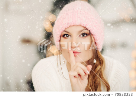 Lovely girl in pink woolen beanie hat making air 70888358