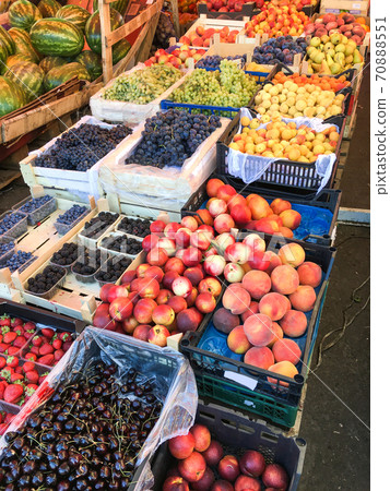 Group of ripe and fresh fruits and vegetables at farmers market. Mobile photo Group of ripe and fresh fruits and vegetables at farmers market. Mobile photo 70888551