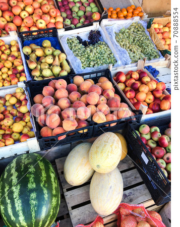 Group of ripe and fresh fruits and vegetables at farmers market. Mobile photo Group of ripe and fresh fruits and vegetables at farmers market. Mobile photo 70888554