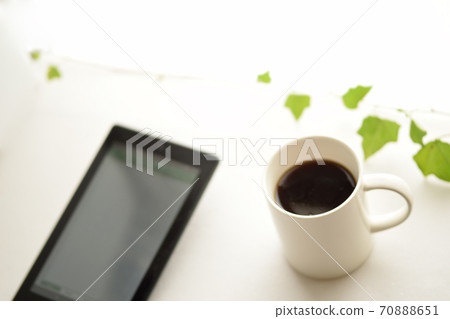 Tablets, coffee and green ivy on a white background. 70888651