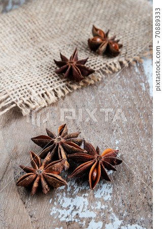Anise stars on rustic background 70889333