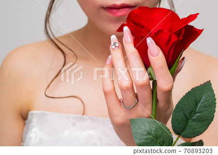 Woman with bridal nails and roses Woman with bridal nails and roses 70893203