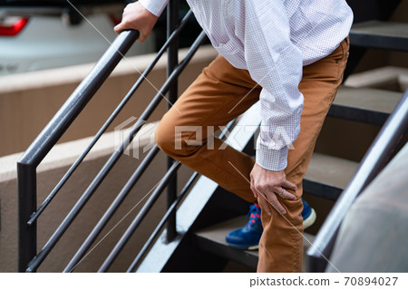 Senior male stairs 70894027