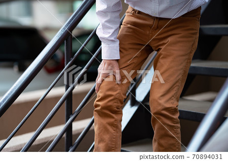 Senior male stairs 70894031