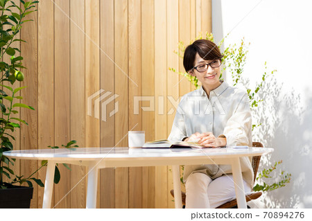 Women's terrace reading, relaxing lifestyle 70894276
